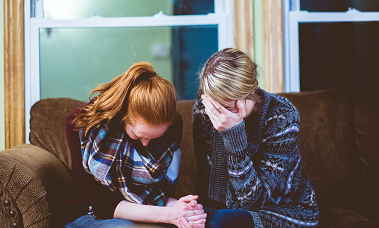 woman crying with supporting friend